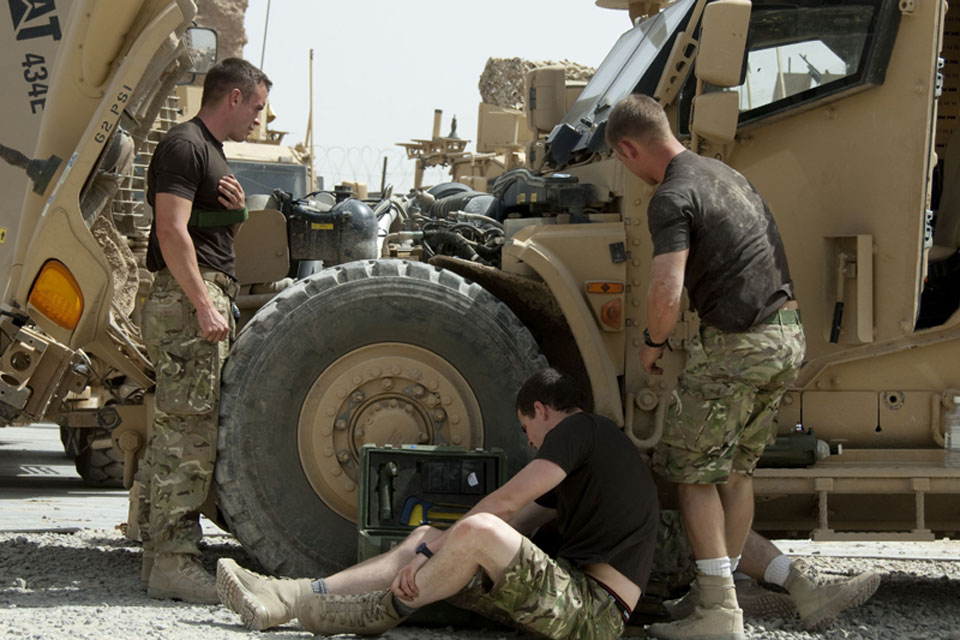 Engineers from 45 Commando's Light Aid Detachment prepare to get to work on a Husky in Helmand