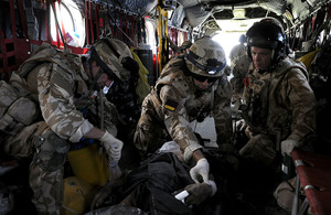 A Medical Emergency Response Team treats a casualty on board an RAF Chinook helicopter in Afghanistan