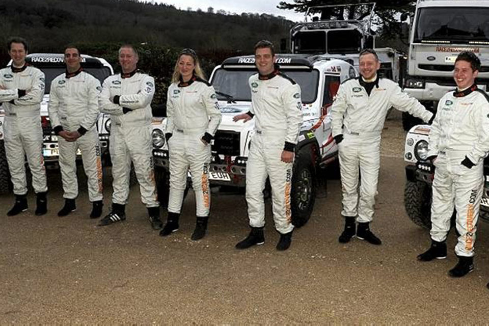 Race2Recovery team members with vehicles
