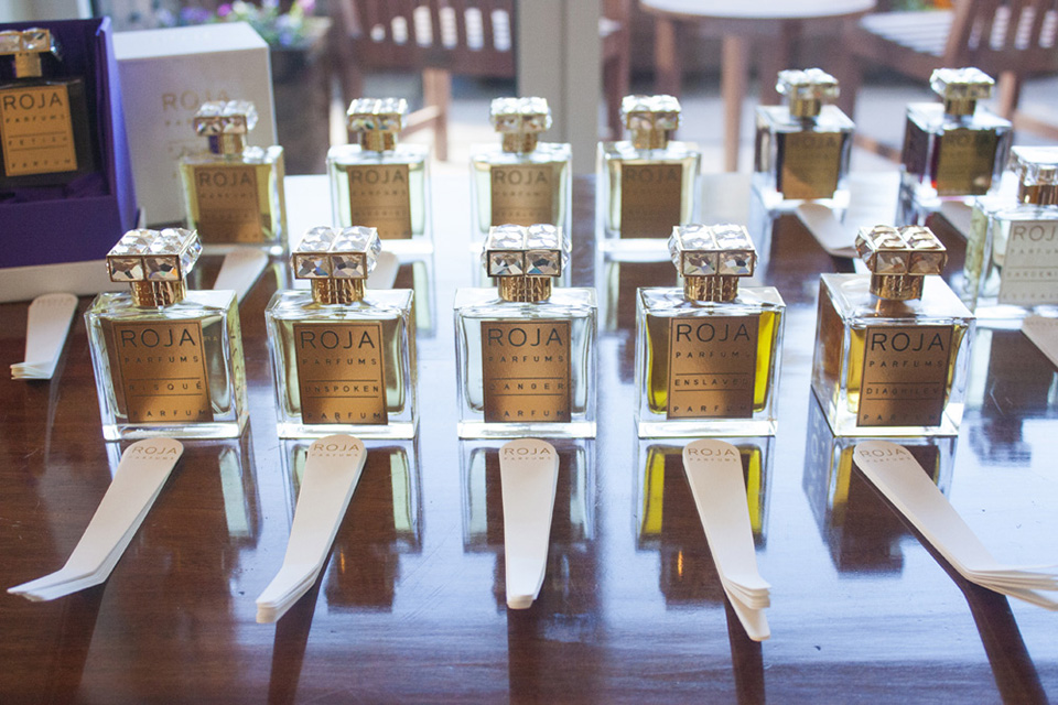 Bottles of ROJA PARFUMS lined up at the British residence.
