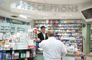 Pharmacist serving a customer