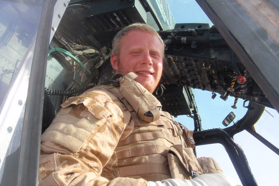 Royal Navy helicopter pilot Lieutenant Charlie Talmage in the cockpit of a Sea King Mark 4 in Helmand