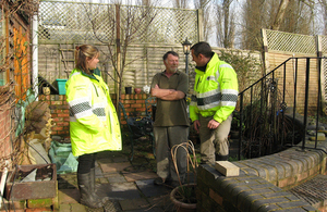 environment agency staff talking to resident