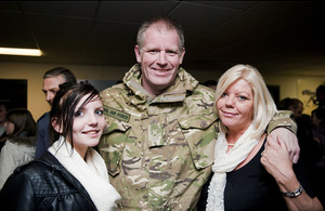 Chief Technician Chadwick is welcomed home by his wife Linda and daughter Kelly