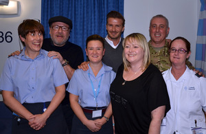 Ray Winstone and David Beckham with staff and patients at the Queen Elizabeth Hospital Birmingham [Picture: via MOD]