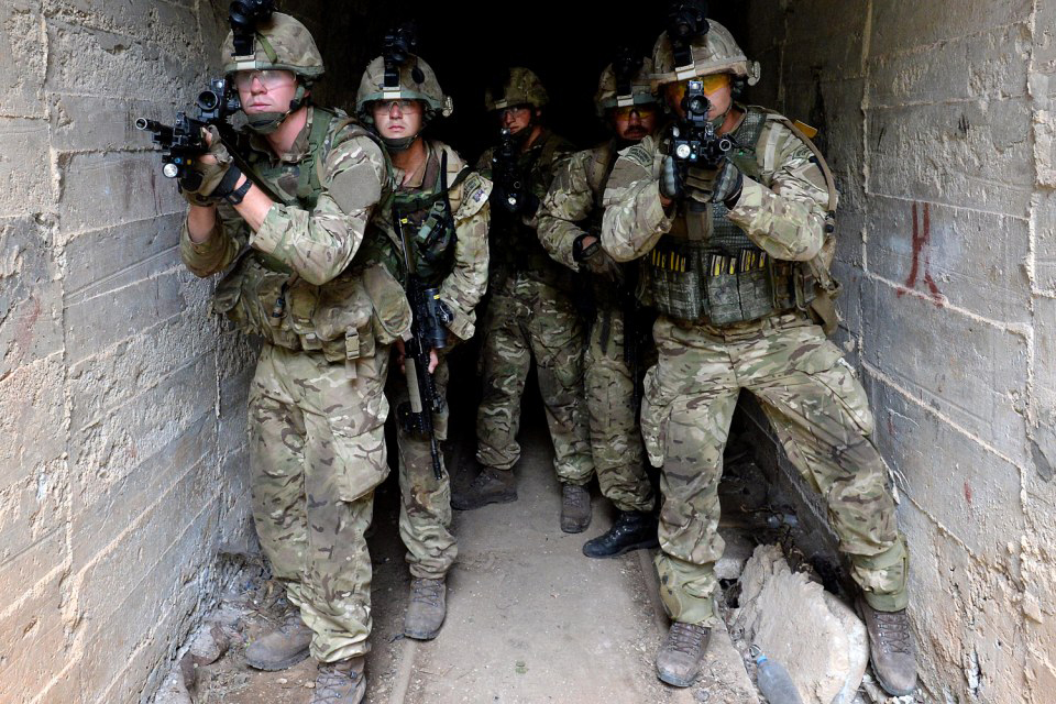 Royal Marines emerge from a tunnel