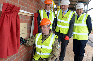 Brigadier Greg Wilson unveils the commemorative foundation stone with (from left) Richard McCarthy, John Leary and Gordon Ray [Picture: Corporal Tim Hammond, Crown copyright]