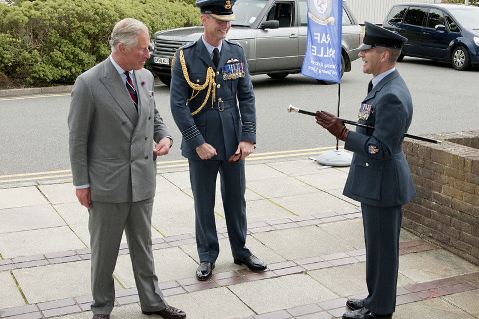 His Royal Highness The Prince of Wales is welcomed to RAF Valley by Group Captain Adrian Hill, the Station Commander, and Warrant Officer Dave Hegarty, the Station Warrant Officer