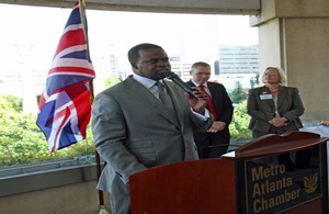 Atlanta Mayor Kasim Reed speaks to a crowd of business and education leaders at the Metro Atlanta Chamber's rooftop pavilion during a reception for the Newcastle delegates.