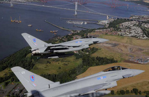 Two Typhoon aircraft from 6 Squadron based at RAF Leuchars fly in a close formation over the Forth Rail and Forth Road Bridges in Edinburgh to mark the stand-up of No 1 (Fighter) Squadron