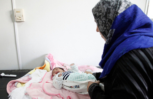 One-month-old baby boy, Walid, is comforted by his mother after a check-up. Picture: Russell Watkins/DFID