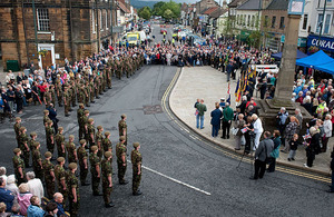 Soldiers of 2nd Battalion The Yorkshire Regiment halt for a short ceremony in Guisborough's market place, attended by the mayor, civic dignitaries and onlookers
