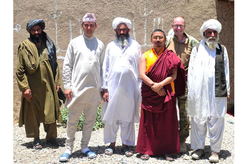 Religious leaders representing the Muslim, Christian, Hindu and Buddhist faiths attend a religious engagement shura at Chah-e Mirza in Nad 'Ali (South), Afghanistan 