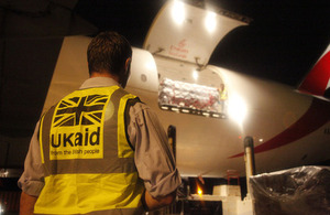 UK aid worker Alex Franklin supervises unloading of humanitarian supplies at Cebu airport. Picture: Simon Davis/DFID