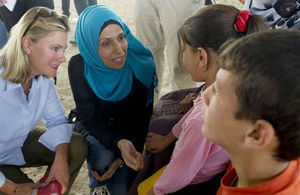 Secretary of State Justine Greening talks to Syrian refugees.