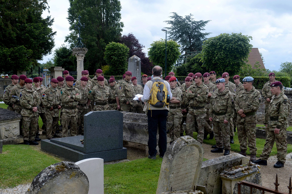 Airborne troops study D Day battlefields
