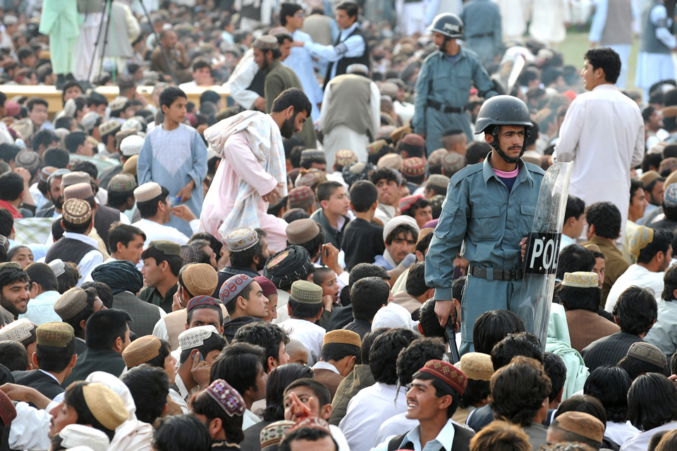 Afghan policemen carry out security duties