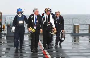 Defence Secretary Michael Fallon (second from left) arriving on board HMS Duncan [Picture: Leading Airman (Photographer) Ben Shread, Crown copyright]
