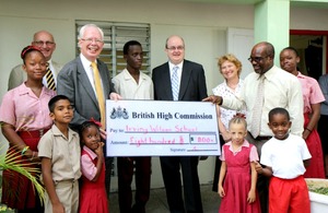 Greening efforts from staff at the British High Commission (BHC) have resulted in the presentation of a cheque for $800 by Lord Wallace of Tankerness to Mr Wilmont Straughn, Principal of the Irving Wilson School.