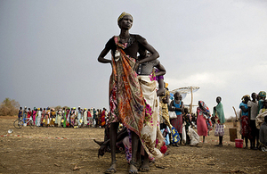 Women displaced by conflict in South Sudan queue to collect food rations in the town of Mingkaman, March 2014. Picture: UNICEF/Kate Holt