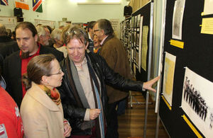 Jeremy Silvester, MAN, explains the exhibition quiz to HE Mrs Marianne Young
