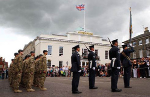 Personnel from II Squadron RAF Regiment stand to attention on Angel Hill, Bury St Edmunds