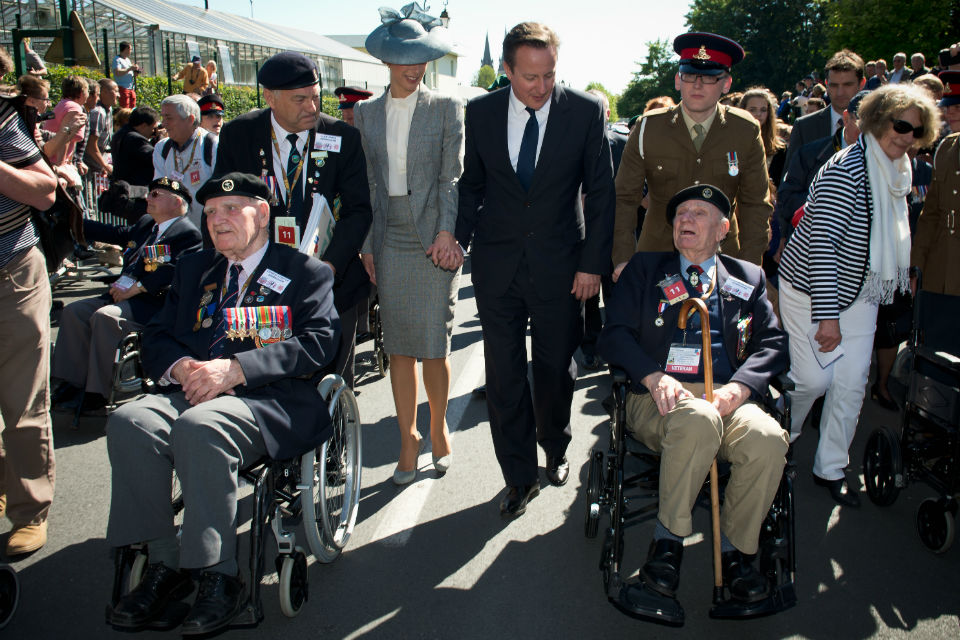 Prime Minister David Cameron and Samantha Cameron with veterans at Bayeux Cemetery.