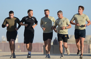 Singer-songwriter Gary Barlow joins British soldiers for a dawn run around Camp Bastion, Afghanistan [Picture: Sergeant Dan Bardsley, Crown copyright]
