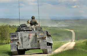 A British Army Warrior armoured infantry fighting vehicle patrolling down the live firing range in Grafenwöhr, Germany [Picture: Corporal Wes Calder RLC, Crown copyright]