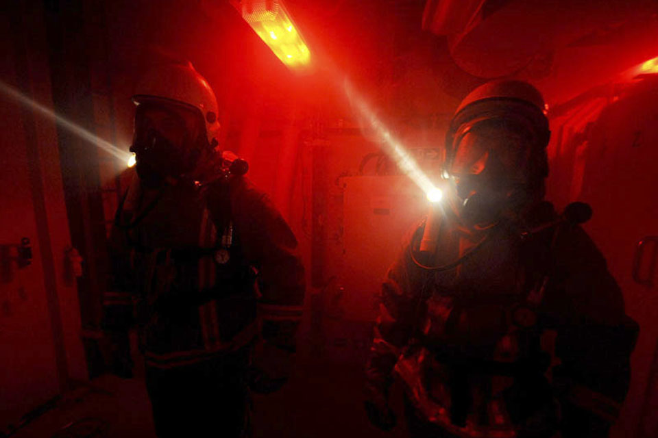 Members of the Fire and Repair Party during a simulated battle damage fire exercise onboard HMS Diamond