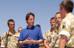 David Cameron talks with British soldiers during a visit to Afghanistan