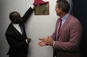Sam Gyimah unveiling a plaque for the opening of the academy with James Timpson.