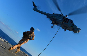 HMS Monmouth's boarding team practise fast roping from a Lynx Mk8 helicopter from 815 Naval Air Squadron