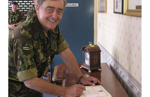 Major General The Duke of Westminster signs the visitors' book at Fenham Barracks, headquarters of 201 Field Hospital