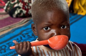 A severely malnourished child feeds himself nutritionally balanced milk in a nutrition unit in Niger. Picture: Gonzalo Höhr/Action Against Hunger