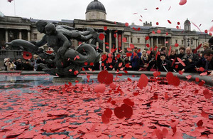 Poppies are thrown into one of the fountains in Trafalgar Square, London, following the two-minute silence for Armistice Day
