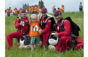 Four-year-old Henry gives a thumbs-up for the Red Devils Parachute Regiment display team