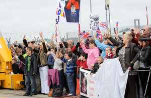 Families on the quayside in Plymouth to welcome home HMS Cumberland