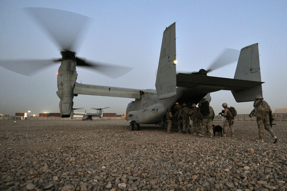 Sunrise, 6 Feb 2012: members of 2 Squadron RAF Regiment and the US Marine Corps board a US Osprey aircraft at Camp Bastion, Afghanistan