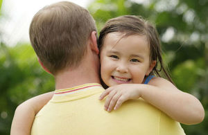 dad hugging his daughter