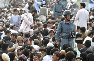 Afghan National Police Officers patrol the crowds gathered for a concert to celebrate Nawruz, the Afghan New Year, at the Karzai stadium in Lashkar Gah