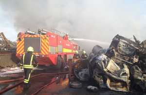 Firefighters tackle a blaze at a vehicle scrapyard and metal recycling facility in Royal Wootton Bassett