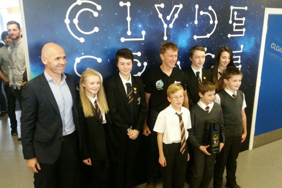 Tim Peake with young people and Chief Executive of Clyde Space.
