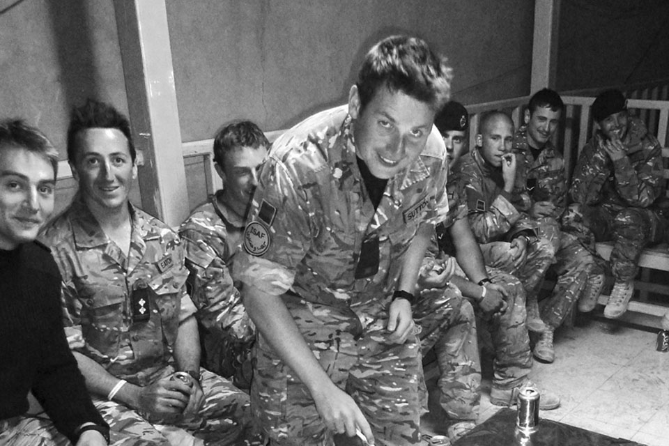 Soldiers from the 2nd Royal Tank Regiment take a break from operations to enjoy some cake and alcohol-free beer as part of their Cambrai Day celebrations in Helmand 