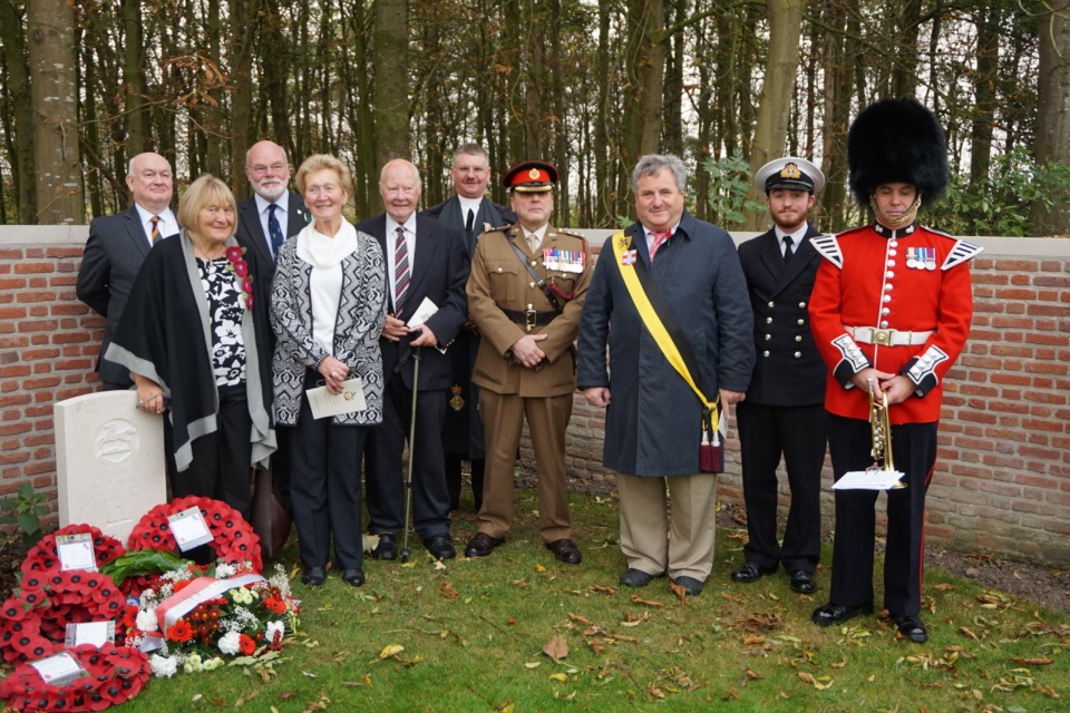 Standing by the graveside of Rifleman Evans his family; Regimental representatives and Deputy Mayor of Ypres; Sub lt Fred Warren Smith; and Max Harris, trumpeter. Crown Copyright. All Rights Reserved.