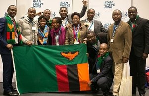 Chevening scholars with flag of Zambia