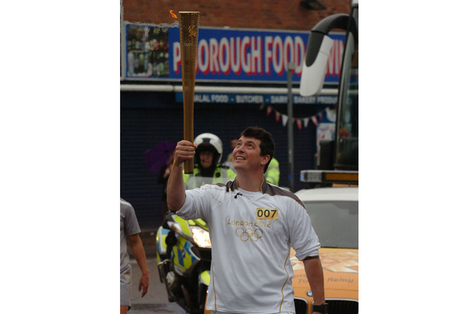 Injured Royal Marine carries Olympic Flame through Peterborough