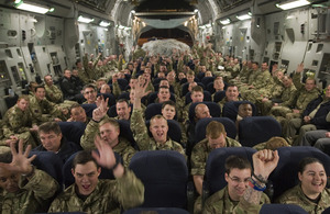 Soldiers from the 1st Battalion Scots Guards on board an RAF C-17 aircraft heading home from Afghanistan [Picture: Corporal Jamie Peters, Crown copyright]