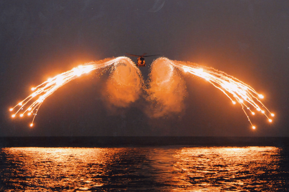A Merlin helicopter test-firing decoy flares 