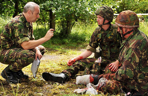 Real amputees act the part of battlefield casualties for the practical assessment stage of the team medic course at Merryfield Training Ground